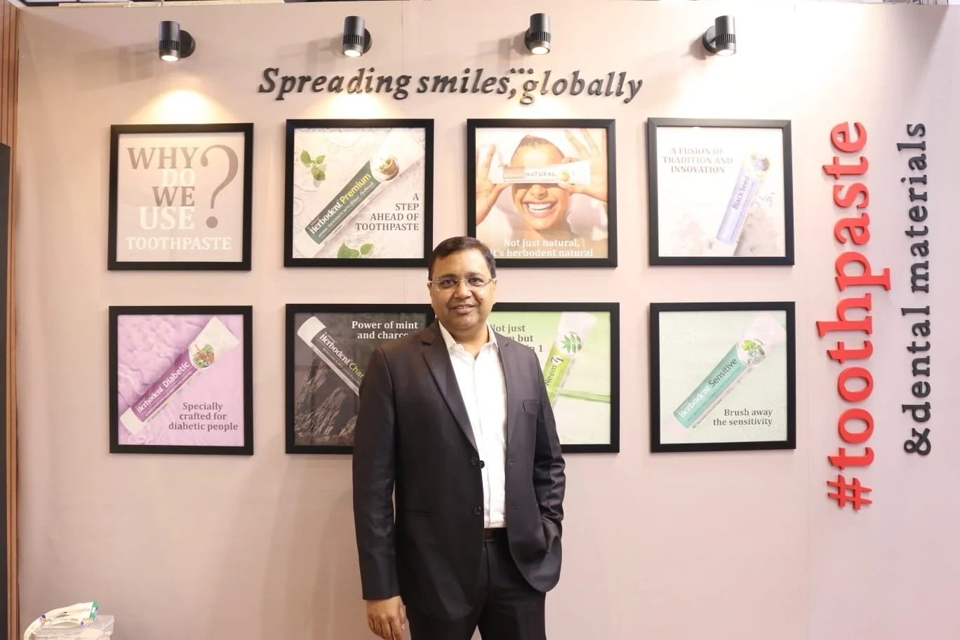 Anuj Jaikaran at a Herbodent trade-show stand